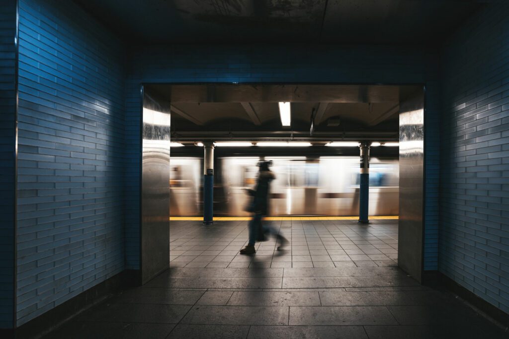 A person walking out of a subway station