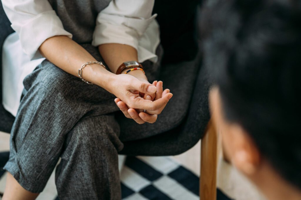 Close-up of woman's hands during meeting