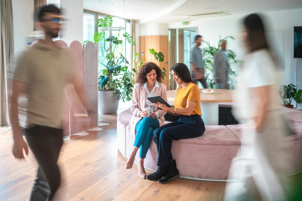 Diverse Female Colleagues Engage in Creative Process at Office