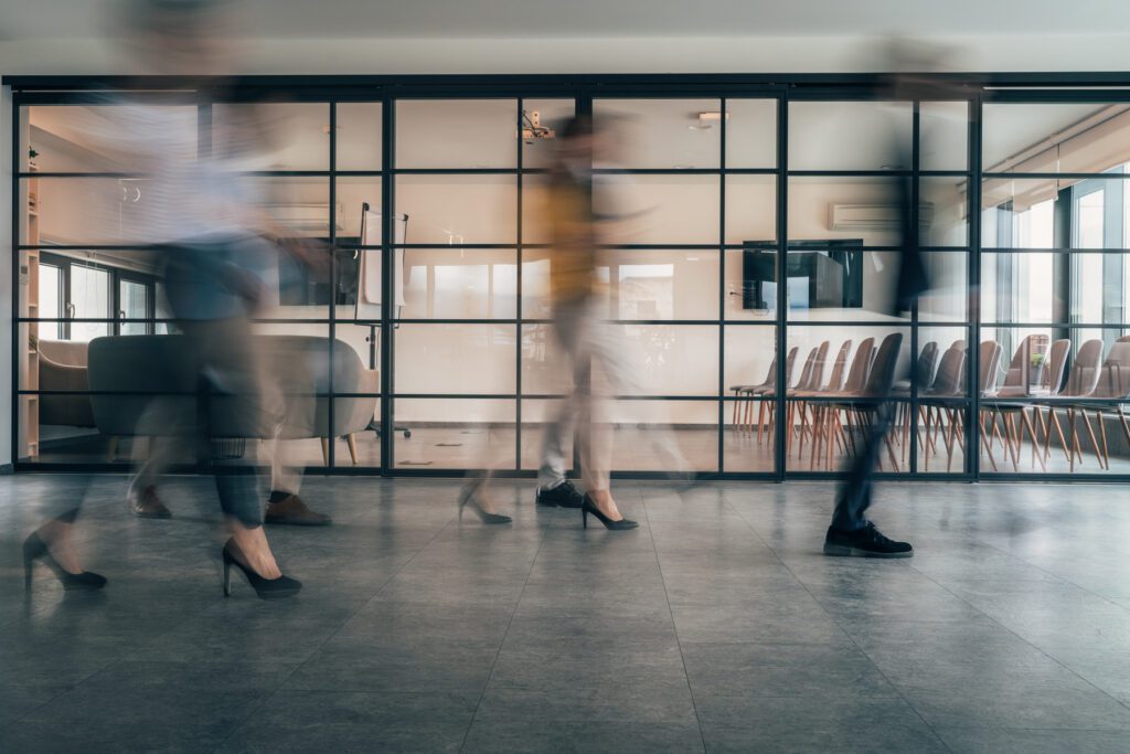 Working process in the office, business people working, walking and talking, blurred motion